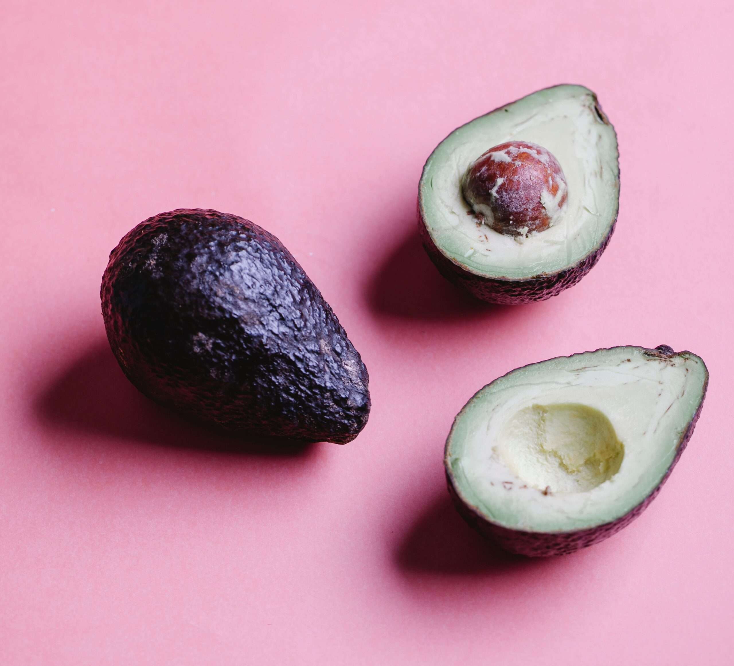 Halved avocados, a low-sugar fruit Dr. Gundry puts on his yes foods list