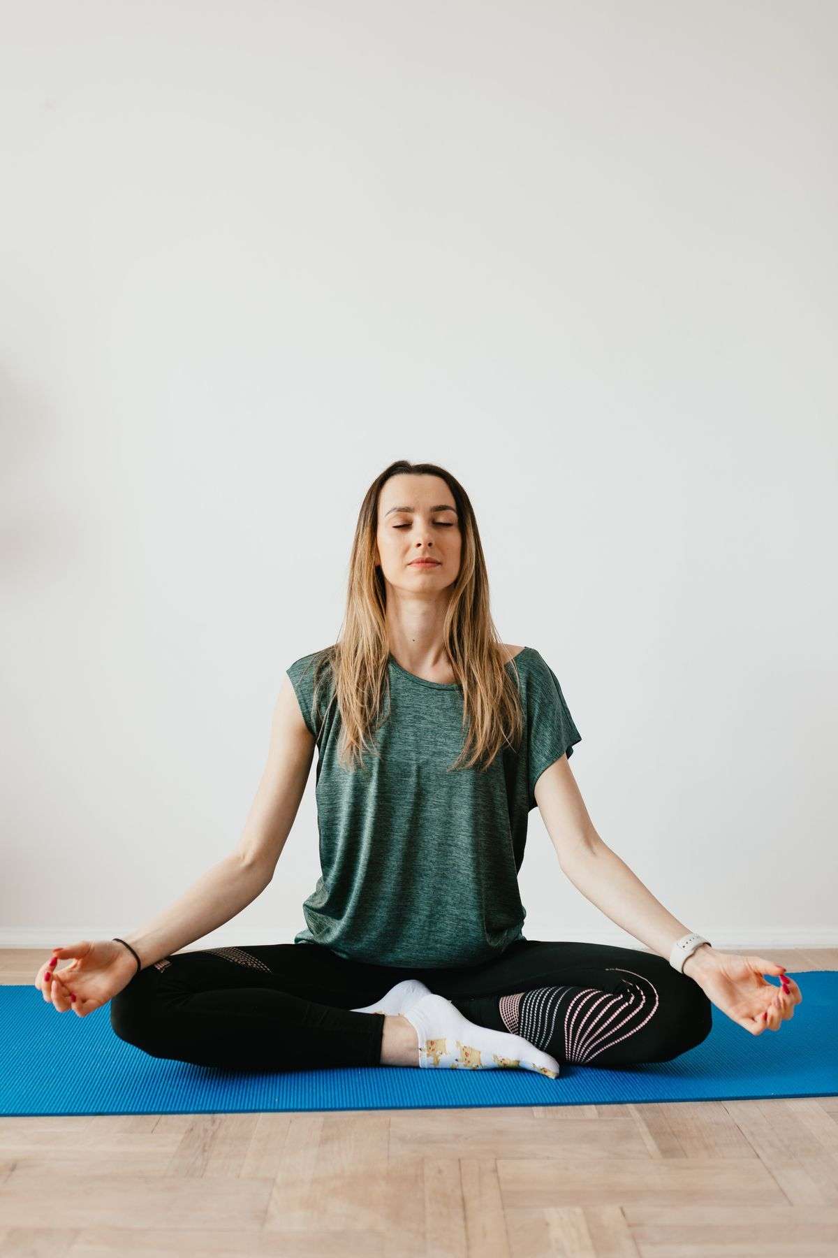 Person practicing the 4-7-8 breathing technique with eyes closed in a calm setting