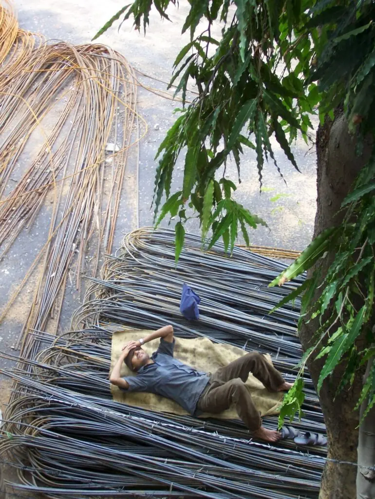 Worker taking a siesta nap at a construction site