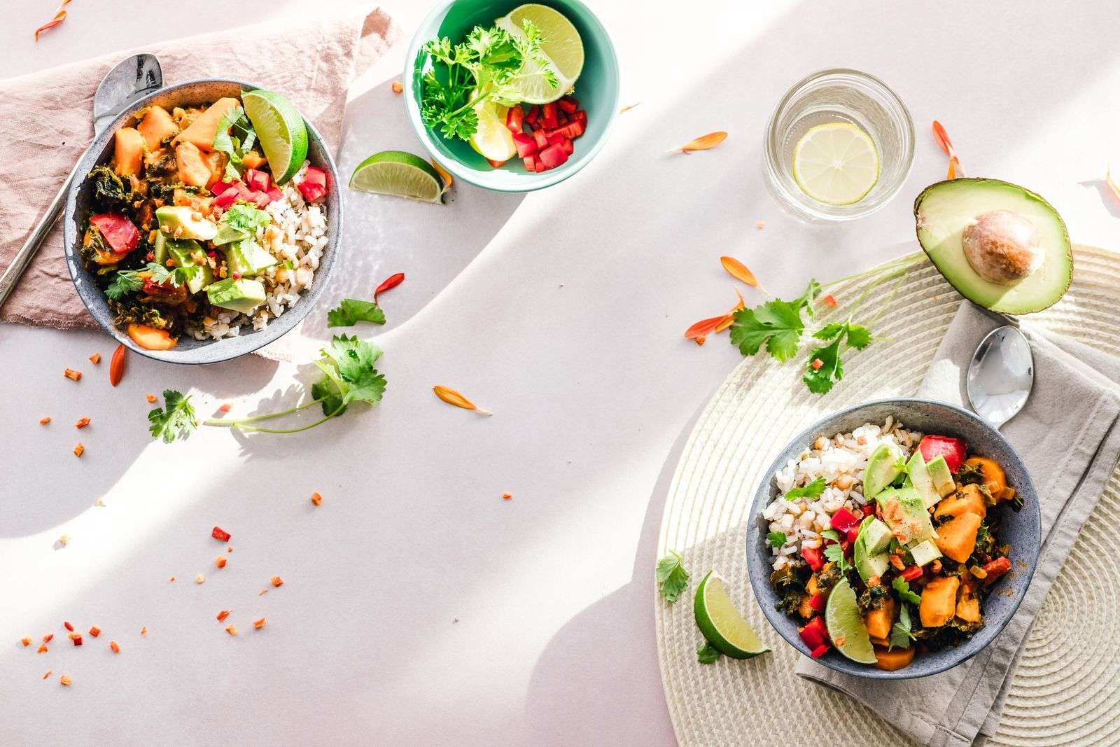 Top-down view of colorful vegetable bowls, plant foods that support autophagy fasting. Photo by Ella Olsson on Pexels.