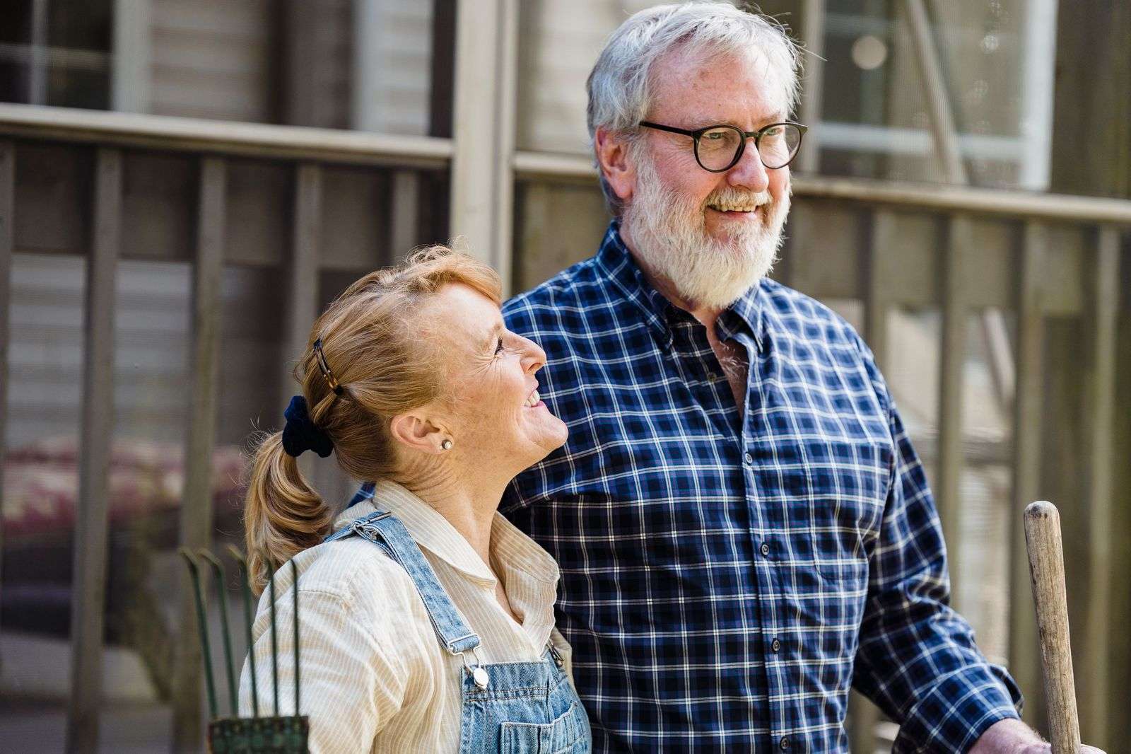 Active older couple gardening together in the sunshine, the natural daily movement at the core of the Blue Zones diet and lifestyle