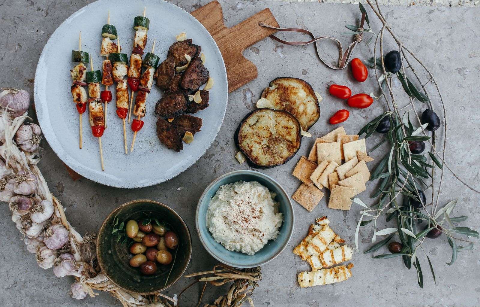 Mediterranean-style appetizer spread with dips and vegetables, the plant-based heart of the Blue Zones diet and lifestyle
