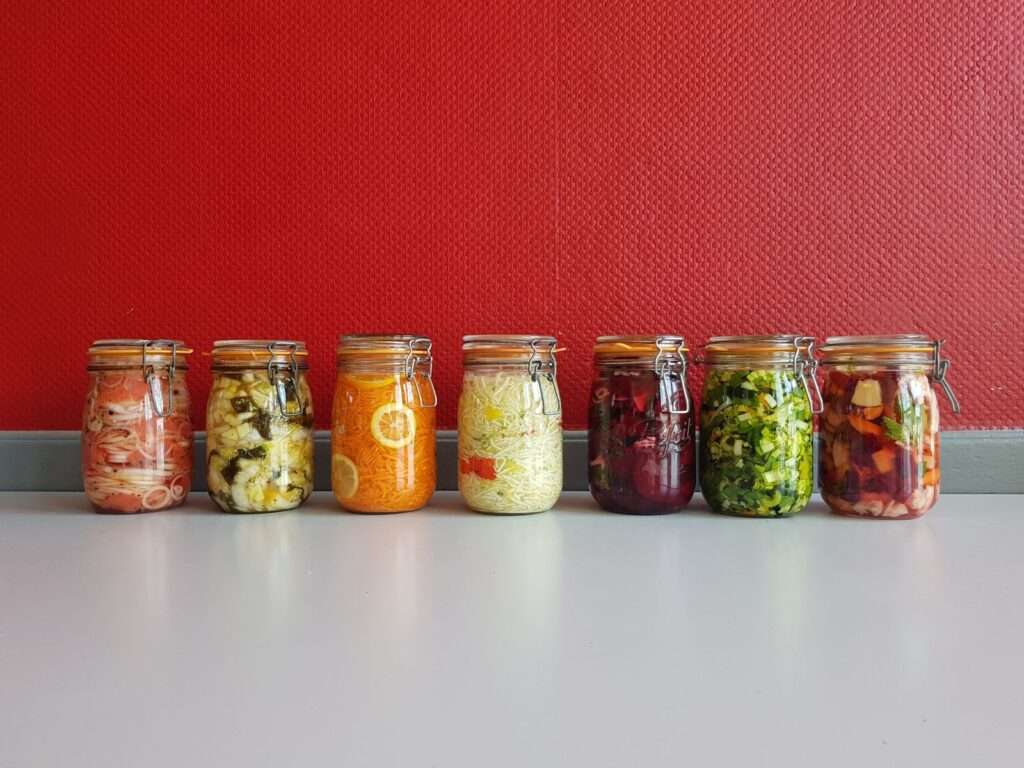 Colorful jars of fermented vegetables that support the gut-brain axis