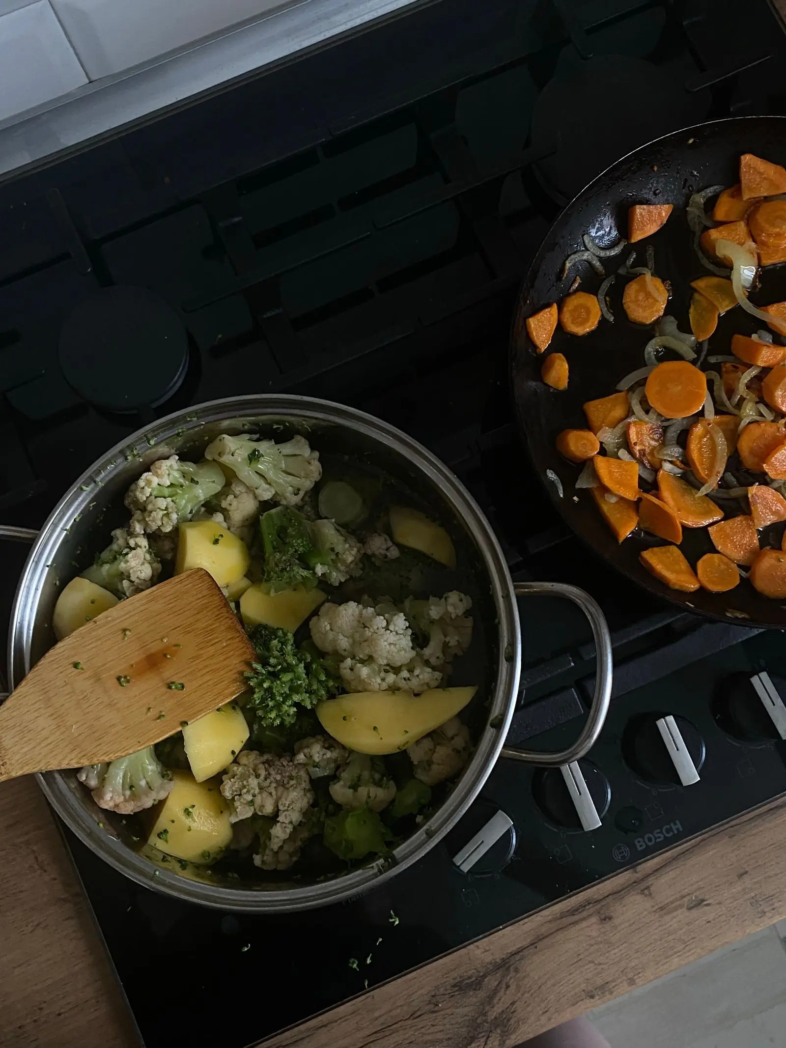 Vegetables cooking in pots on a stove, showing how heat destroys lectins in food