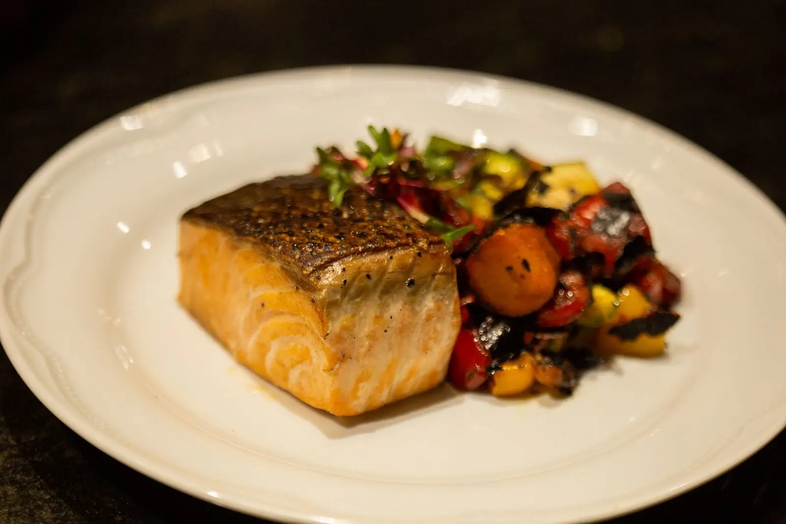 Heart-healthy Mediterranean meal: seared salmon fillet with roasted vegetables